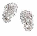 anthemion, pavé set with old cut and eight cut diamonds, to clip and post fittings, indistinctly stamped to reverse Length: 22mm 1,000-1,200 24 A French diamond set pendant clip brooch comprised of