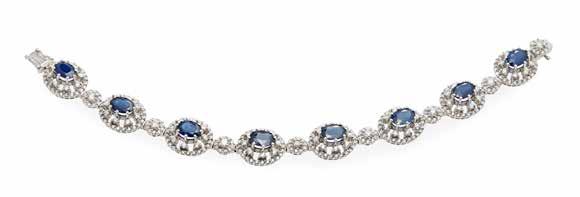 Select Jewellery & Watches 35 48 A sapphire and diamond set bracelet designed as eight sapphire and diamond clusters each centred by an oval cut sapphire within an openwork mount claw and pavé set