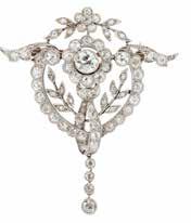 Select Jewellery & Watches 9 7 A Belle Époque diamond set brooch millegrain set to the centre with an old round cut diamond, in a similarly set border, the open scrolling
