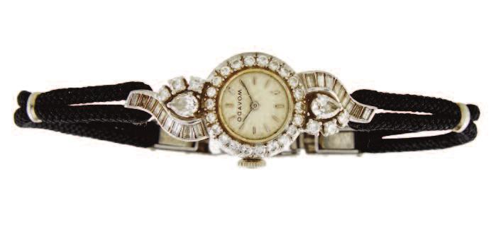 Fine Jewellery Auction - Tuesday 29 November 2016 at 7 p.m. 34 LADY S MOVADO WRISTWATCH 17 jewel movement; in a platinum case set with 18 baguette cut, 2 pear cut and 28 brilliant cut diamonds (approx.