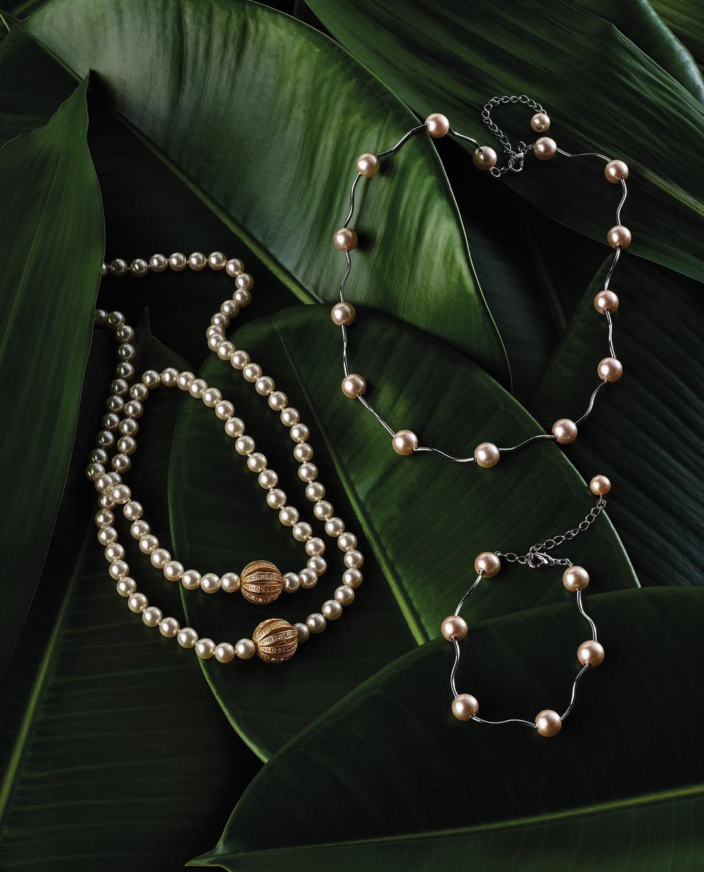 02 03 01 01 PEARL NECKLACE CODE: 2288 89,90 Extra-long necklace with individually knotted pearls, 8mm in diameter, it also features two large filigree bead stations, plated in yellow gold with satin