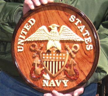 US Navy Plaque: Here is another donated Item that is absolutely beautiful. It is a 12 diameter beauty, made with wooden inlay and raised lettering, and an exquisite lacquer finish.