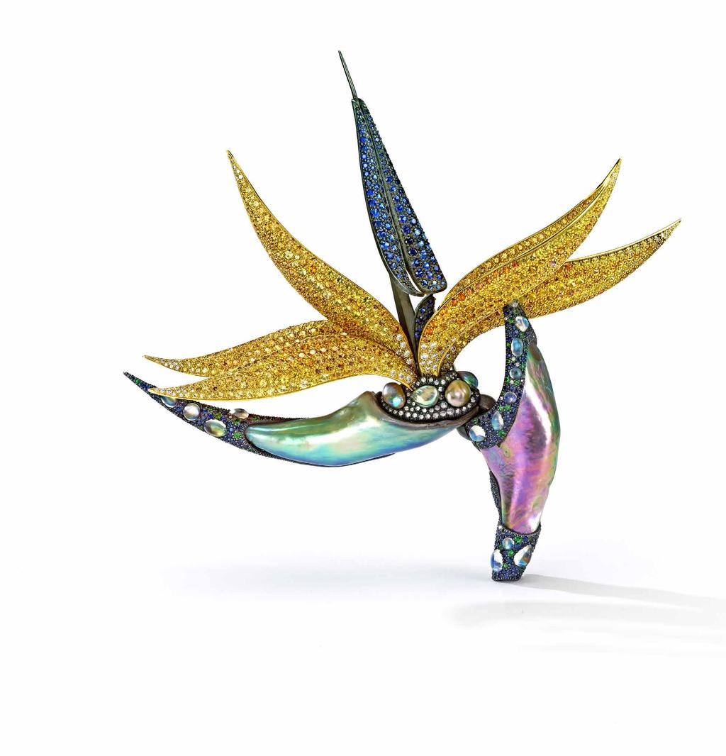 Designed as a realistic mature bird of paradise flower, this brooch by Nicholas Varney has a canoe-shaped bud, defined by two abalone horn pearls, sprouting five gently curving sepals embellished