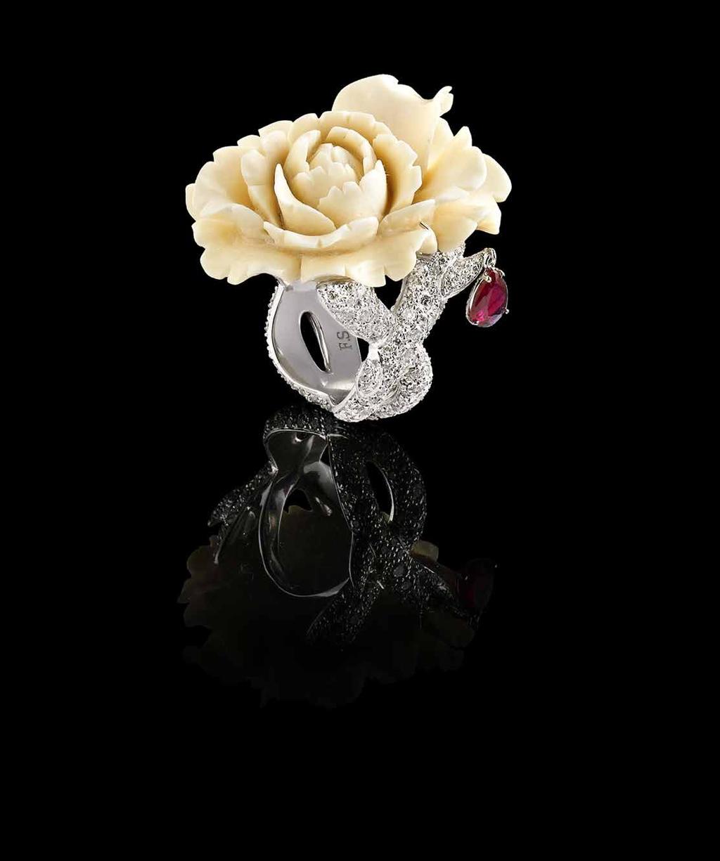 www.fabiosalini.it Ring in 18K white gold set with ivory (from Mammoth fossil), one 0.68-carat pear-shaped ruby and pavé-set diamonds (3.27cts). POA.