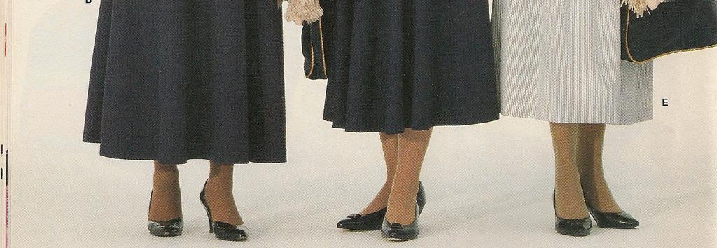 Stripe Belt, Navy Leather (until 1995) Cardigan, Navy (until 2001) Sweatshirt, Navy with White Maple Leaf Motif Stockings, Neutral (until