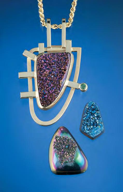 Figure 16. A plasma-deposited titanium coating creates the iridescent, high-luster surfaces in this 24- mm-long pendant-set cabochon and the two freeform cabochons.