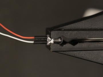 Add heat shrink tubing to insulate the exposed