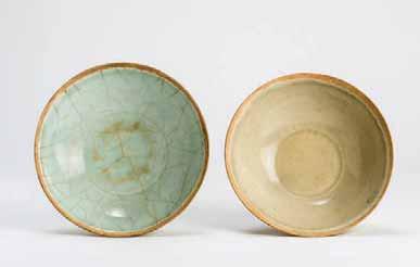 China, Song to Ming dynasty All three bowls are Longquan ceramic or stoneware. The small bowl with dark, olive-green glaze and craquelure is unglazed only on the small ringshaped foot.