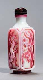 With floral depictions on all four sides in pink overlay glass on a white background. Agate stopper; with spoon.