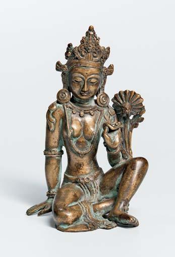 $900-1,200 64 Parcel Gilt-bronze Figure of Standing Tara, Tibetan China, on a double lotus base (separately cast), her body configured with two separate casts joined at the waist, her right arm