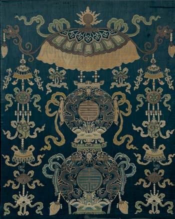 146 Imperial Kesi Throne Cover, China, 18th/19th century, woven with a Buddhist canopy suspending roundels containing shou symbols, surrounded by symbols of the heavens and earth and pairs of dragons