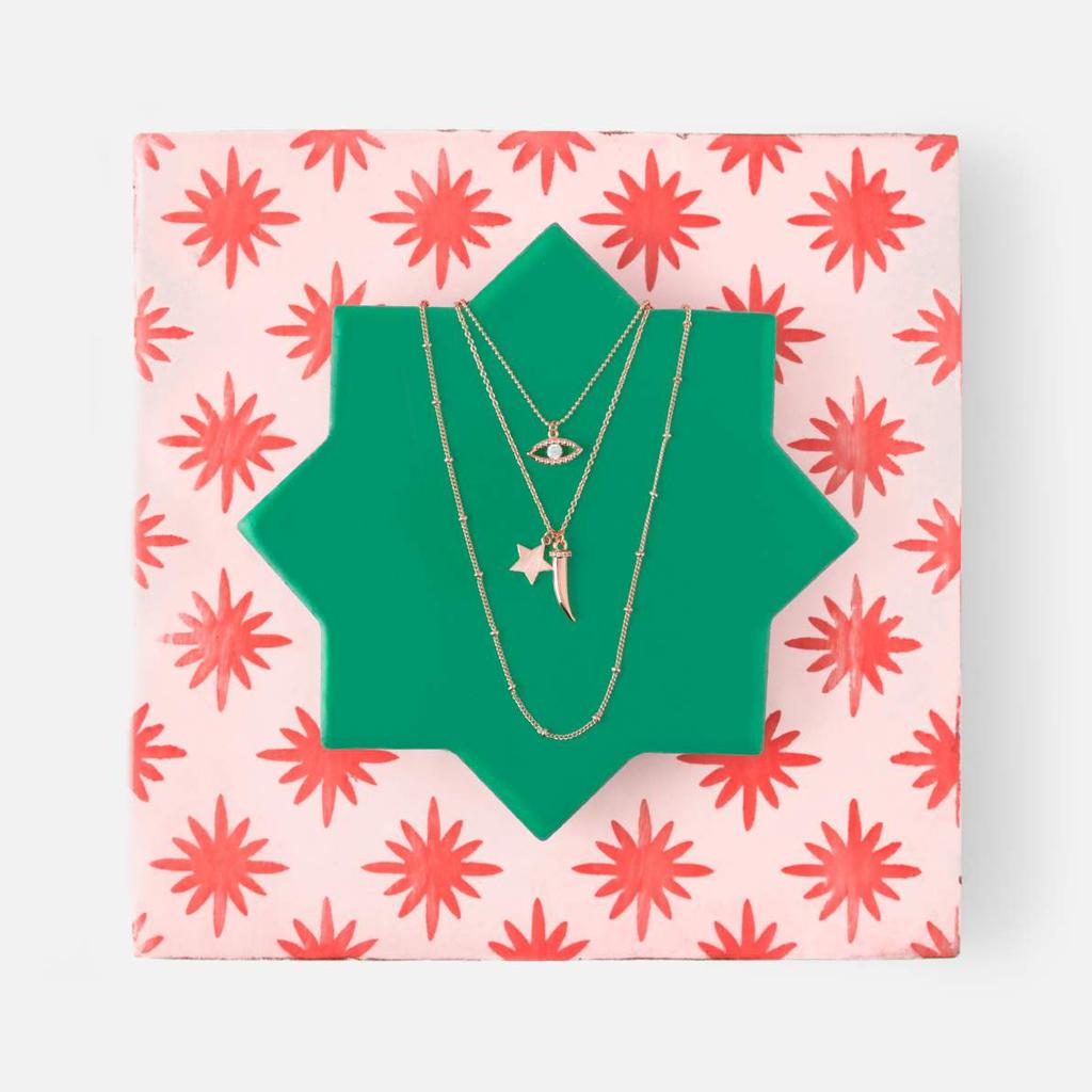 hues of deep raspberry and emerald along with pops of coral and