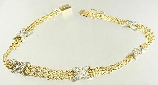 543 544 545 546 547 548 549 550 551 552 Lot # 553 553 14k yellow gold and white gold bracelet, with consignor's appraisal. $250 - $500 554 Pair of 18k yellow gold and pink topaz earrings.