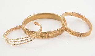 133 AND Lot comprising 3 14K yellow gold rings each set with a small brilliant cut