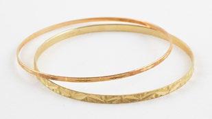 196 Lot of 18K yellow gold bracelets with charms.