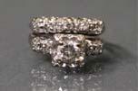 set and round brilliant diamonds (0.90ct). Includes appraisal from local gemologist. in. 800.00-1,000.