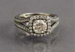 00 41 CUSTOM SWIRL STYLE DIAMOND RING - A 14K white gold ring with nine round brilliant cut