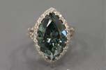 treated intense blue-green diamond (10.07ct), six marquise shaped mixed cut sapphires (0.