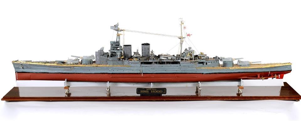 Lot 301 301 A MODEL OF THE BRITISH ROYAL NAVY BATTLECRUISER 'H.M.S. HOOD' of mixed material construction, approximately 133cm long, in a glazed display case, overall 138cm long.