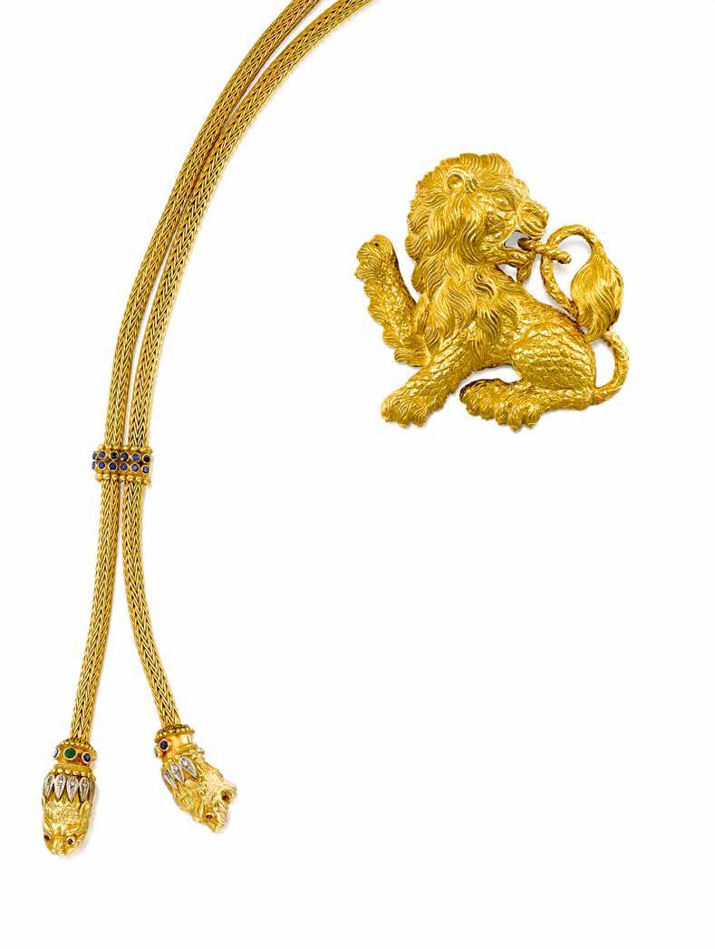 48 47 AN 18K GOLD AND GEM-SET LARIAT NECKLACE, ILIAS LALAOUNIS, GREECE centering a double lion heads pendant, suspending from a woven gold chain with single-cut sapphire, emerald, ruby and diamond