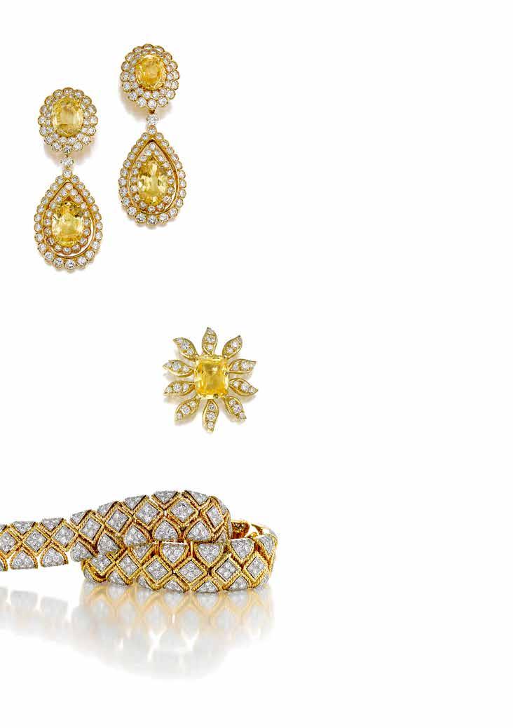 PROPERTY OF THE JOYCE B. DOHENY TRUST 94 94 A PAIR OF YELLOW SAPPHIRE AND DIAMOND DAY/NIGHT EAR CLIPS, VAN CLEEF & ARPELS set with oval modified mixed-cut yellow sapphires, weighing 10.99 and 11.