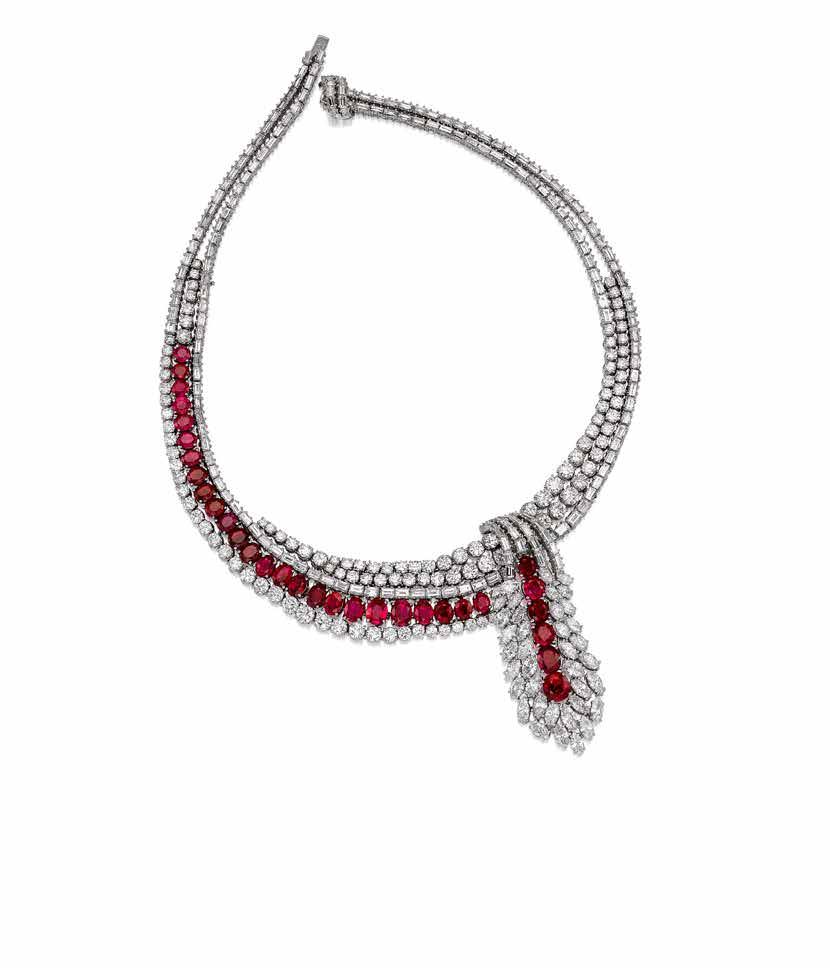 171 A DIAMOND AND RUBY NECKLACE designed as an articulated, marquise, baguette and round brilliantcut diamond ribbon, enhanced by oval and round mixed-cut rubies, estimated total diamond weight: 48.