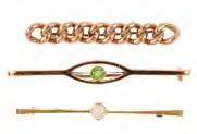Length 18.2cms. Weight 16.3gms. 90-140 572 A selection of three early 20th century 9ct gold gem-set bar brooches.