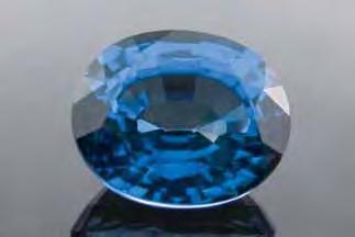 Figure 45. This 5.85 ct blue oval mixed cut was identified as a flame-fusion synthetic sapphire treated by a diffusion process. Photo by C. Golecha. Figure 46.