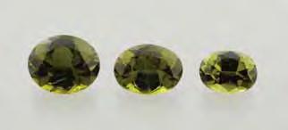 Figure 11. These yellow-green diopside samples (1.33 2.75 ct) reportedly came from Badakhshan, Afghanistan. The stone in the center (GIA Collection no. 36612) is a gift of Intimate Gems. Photo by C.
