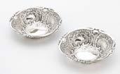 110. A pair of Edwardian silver bon bon dishes by William Hutton & Sons, circular with embossed