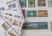 A collection of British and World stamps, in five books and folders, including two penny reds, some early 20th