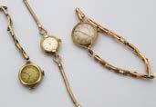 290. A group of three early 20th century gold cased ladies wristwatches, one an 18ct gold cased J.W.