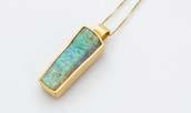A 9ct gold and gem set pendant on chain, together with a gold and opal ring and an 18ct gold and gem set ring (3)
