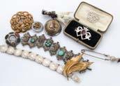 A collection of costume jewellery and other items, including various necklaces, brooches and other jewels, several watches, a Far Eastern head dress, a