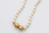 A modern cultured white pearl necklace, with a 9ct gold bow style clasp 560.