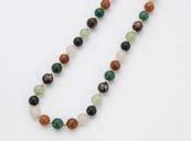 A nice Chinese hardstone and enamel bead necklace, having rose quartz, jadeite, carnelian and other beads, with silver gilt clasp 604.