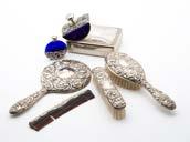 A 1980s silver four piece dressing table set, together with a blue glass and silver plated scent bottle