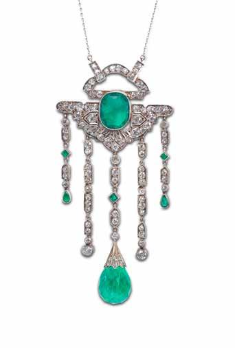 42 41 41 AN EMERALD AND DIAMOND PENDANT/NECKLACE, CIRCA 1920 Designed as a pierced geometric plaque set with a central cushionshaped emerald within an old brilliant-cut diamond ground, suspending a