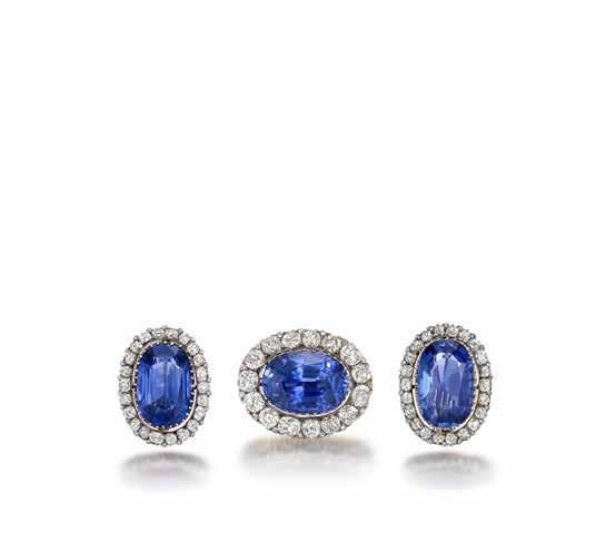79 (actual size) 79 A SAPPHIRE AND DIAMOND CLUSTER BROOCH AND EARRING SUITE Each set with a large oval-cut sapphire within a border of old brilliant and rose-cut diamonds, the sapphire in the brooch