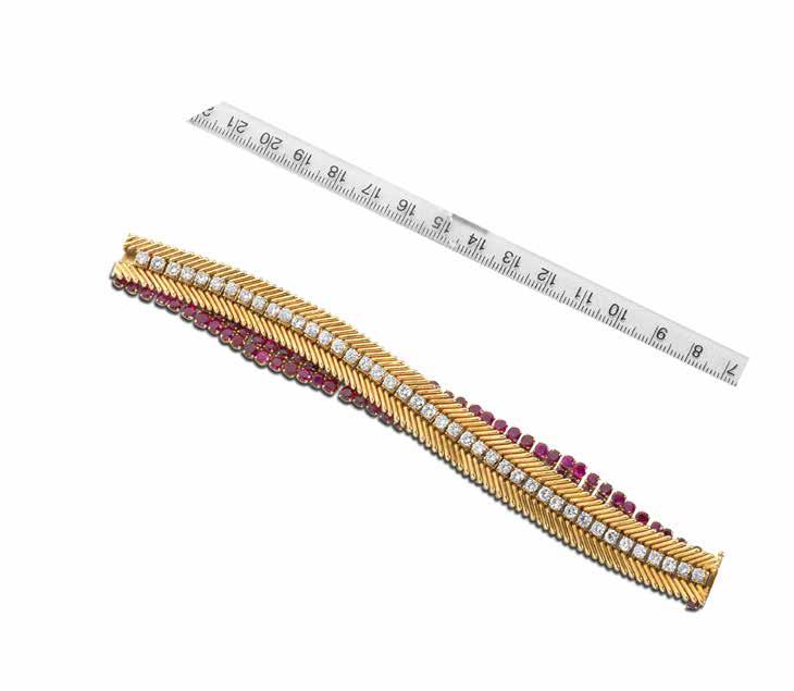 100 A RUBY AND DIAMOND SHUTTER BRACELET WATCH, BY VAN CLEEF & ARPELS, CIRCA 1950 The highly articulated brick-link strap with two central shutters, opening to reveal a rectangular watch face, signed
