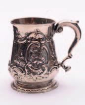 An Imperial Russian silver and gilt decorated presentation cup and spoon, the cup holder with clear glass liner, decorated with a pierced fence and gable end of a house with a young girl peering