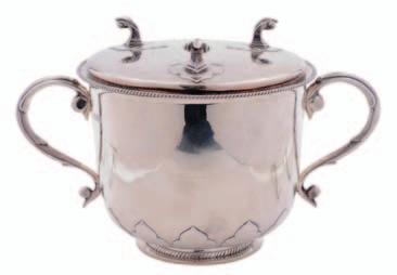 An Edward VII Britannia Standard porringer and cover, scroll handles, stiff leaf decoration and gadrooned rims, the