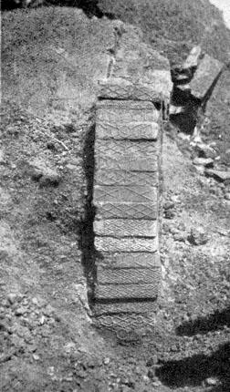PLATE V. Ornamented bricks in situ. Part of the south grave.