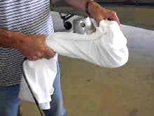 Grab the polishing cloth and wrap it around the front handle of the polisher, gripping it tightly.