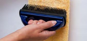 Step 4 When you have finished, brush the collected dust and hair out of the mop using