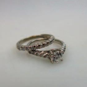8 $350 450 216 set with 40 baguette cut, 9 princess cut and 9 full cut diamonds (approx. 1.40ct.t.w.), size 8, 6.