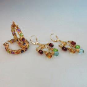281 2 PAIRS OF 14K YELLOW GOLD EARRINGS each set with a variety of cut amethyst, garnet,