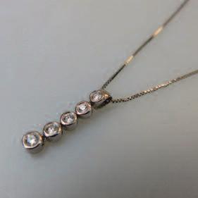 ), suspended on a 14k white gold box link chain length 18 45.7 cm., 3.