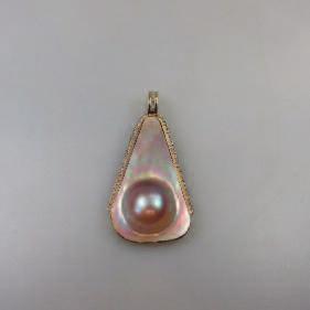 325 14K YELLOW GOLD PENDANT ENHANCER set with a mabé pearl panel and 51 small single cut diamonds 326