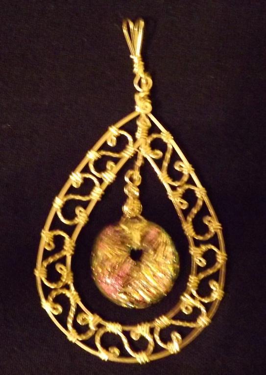 Doris Keane has donated a second pendant fashioned from gold-filled wire around a
